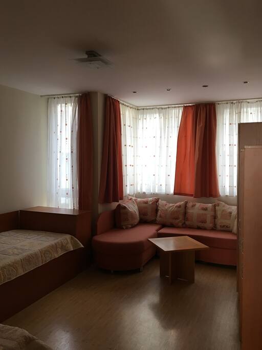 Bedroom with two single beds and one sofa bed.
