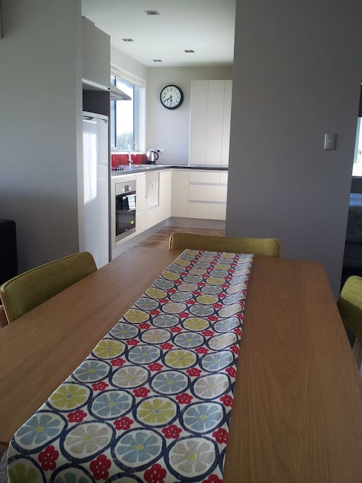 Dining table - seats four. Kitchen with cook top, oven, fridge, cutlery & crockery for four. Includes plunger for coffee or tea.