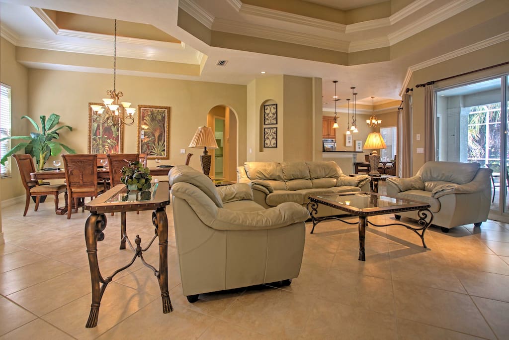 Relax in the living room with leather sofas and a flat-screen cable TV.