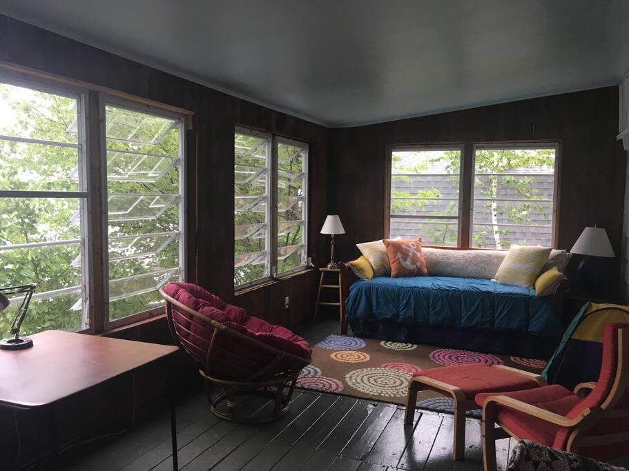 enclosed porch overlooking the lake and facing the direction the sun sets