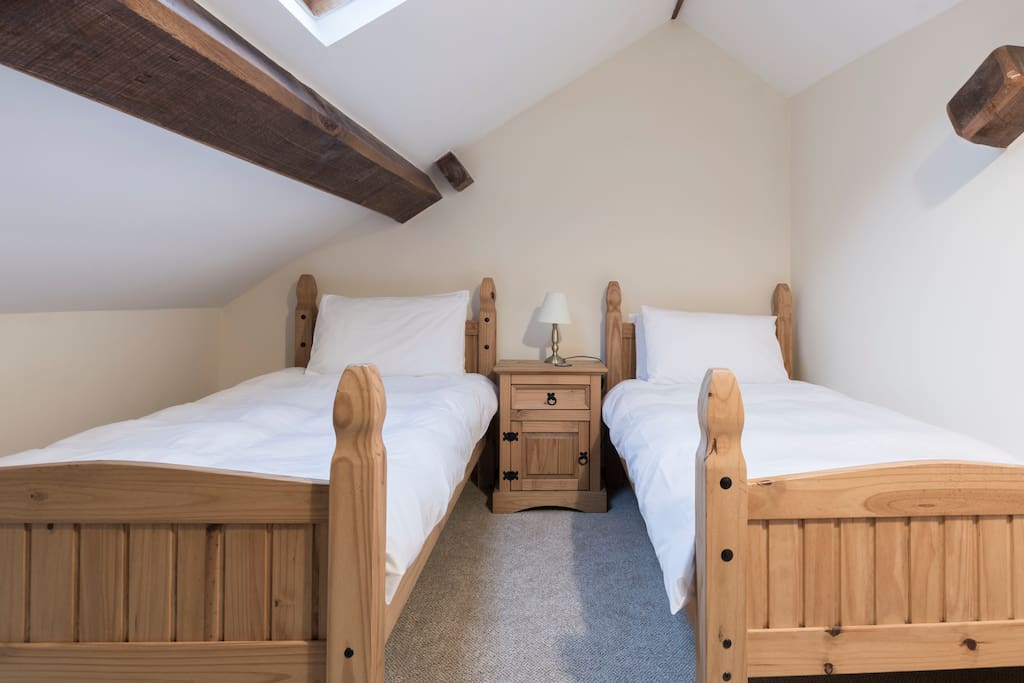 A twin bedroom accessed through the galleried bedroom.