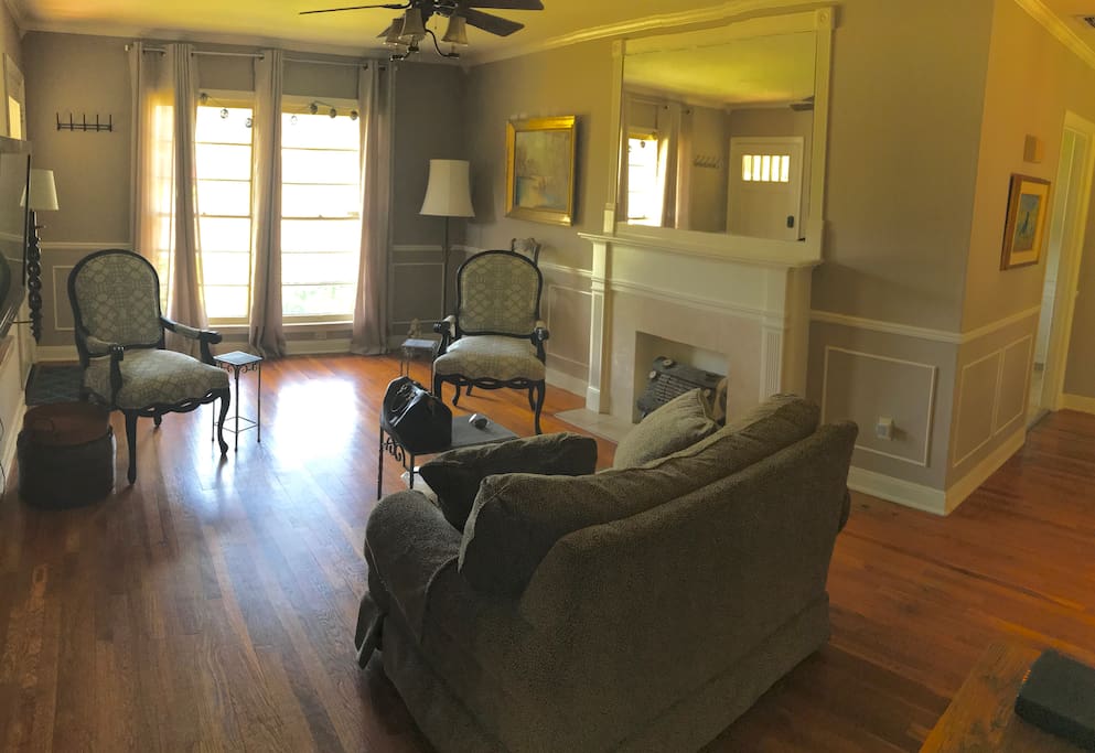 Living Room with giant windows looking out the front of the house and plenty of cheerful West Texas sunlight!