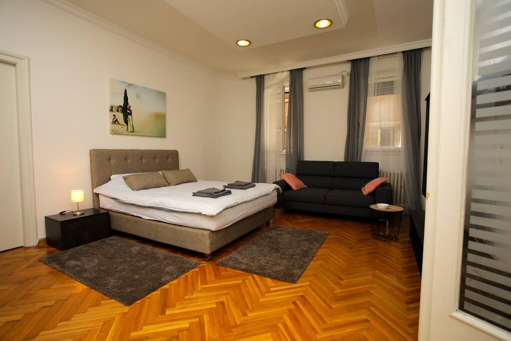 Bedroom 1 - big room with a brand new queen size bed and comfortable sitting sofa