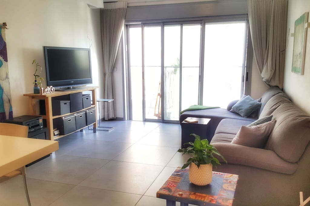 Open space. Kitchen opens into living room with full wall of sliding glass doors for indoor/outdoor living. Doors lead to large terrace. Perfect for your morning coffee or a sunset glass of wine.