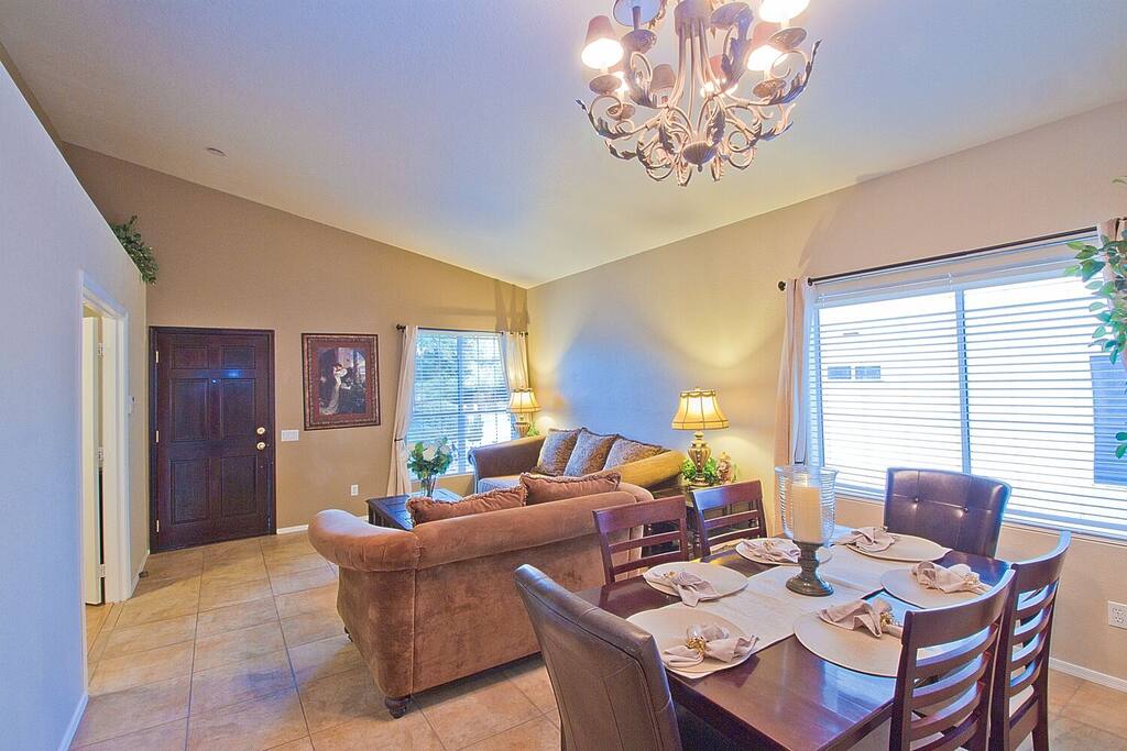 Formal dining table sits 6, with aditional 8 sittings in kitchen area, and 6 more at patio table.