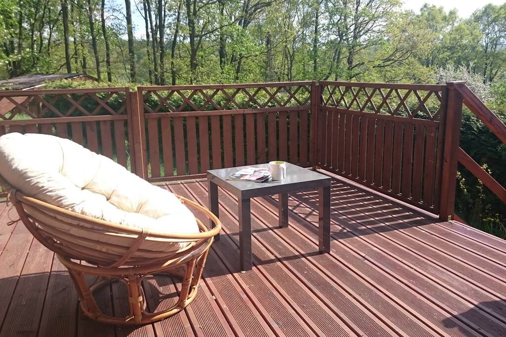 sunny terrace with comfortable relaxing chair