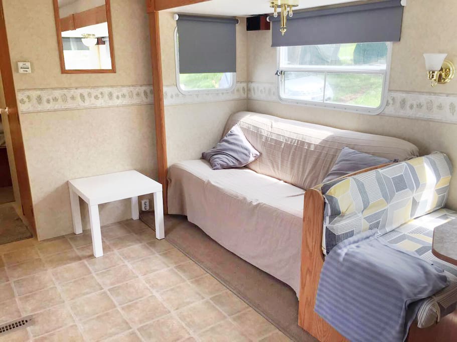 living space with a sofa that turns into a double bed suitable for a couple or two children