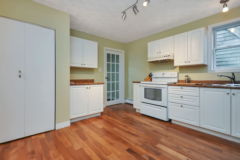 You'll enter our house through the glass pane door and instantly enjoy the hardwood floors.
