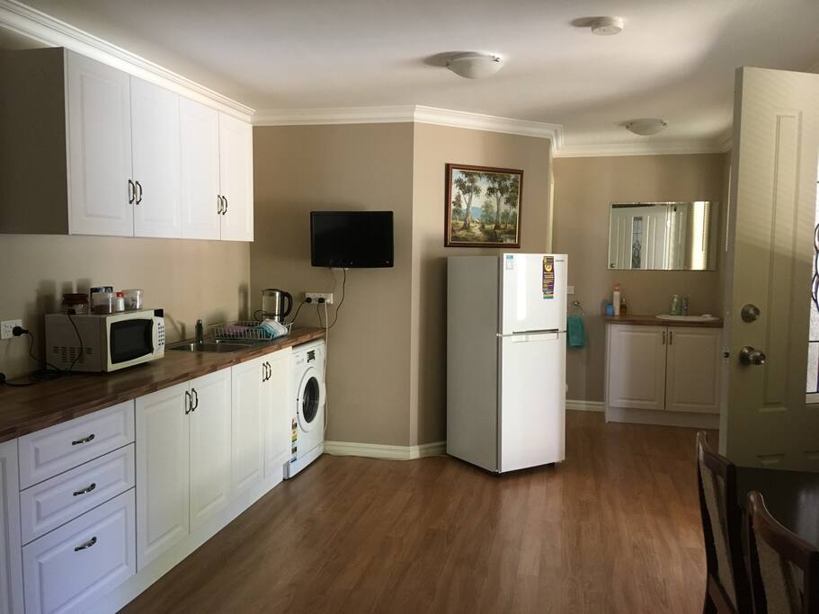 TV, microwave, washing machine and fridge
