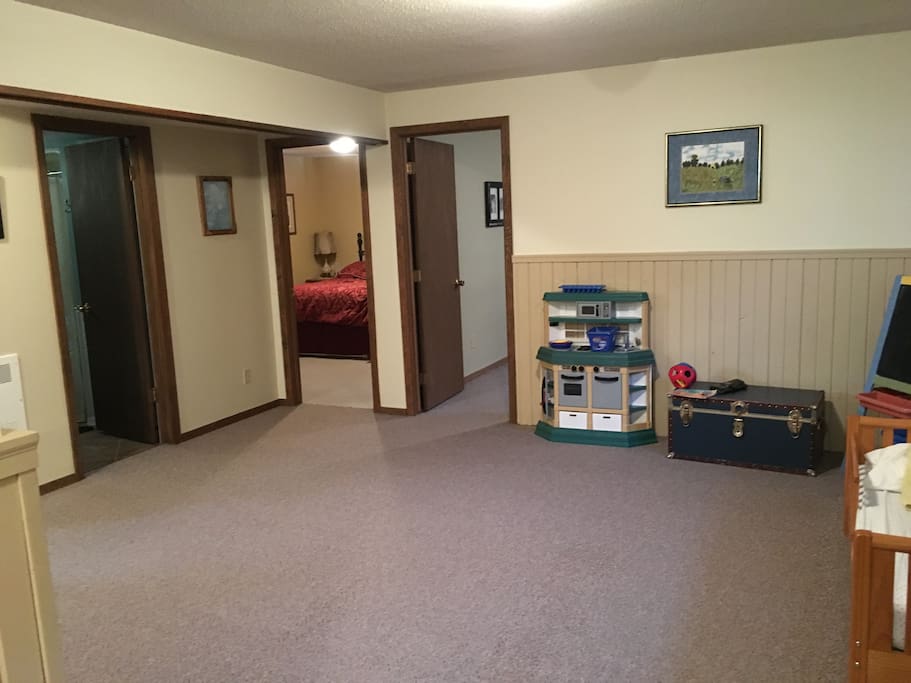 Common Area with Toddler Bed Pack & Play in closet