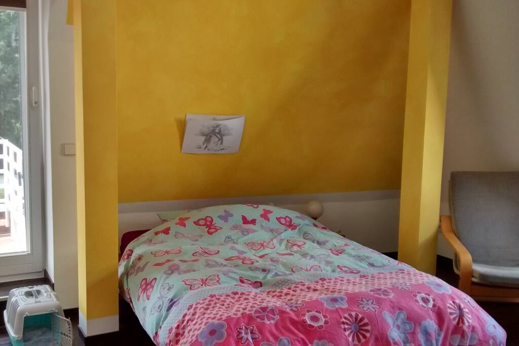 double bed in the bedroom with access to balcony