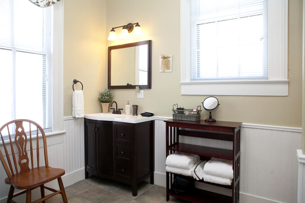 Large bathroom with lots of light. Shower only, no bathtub.