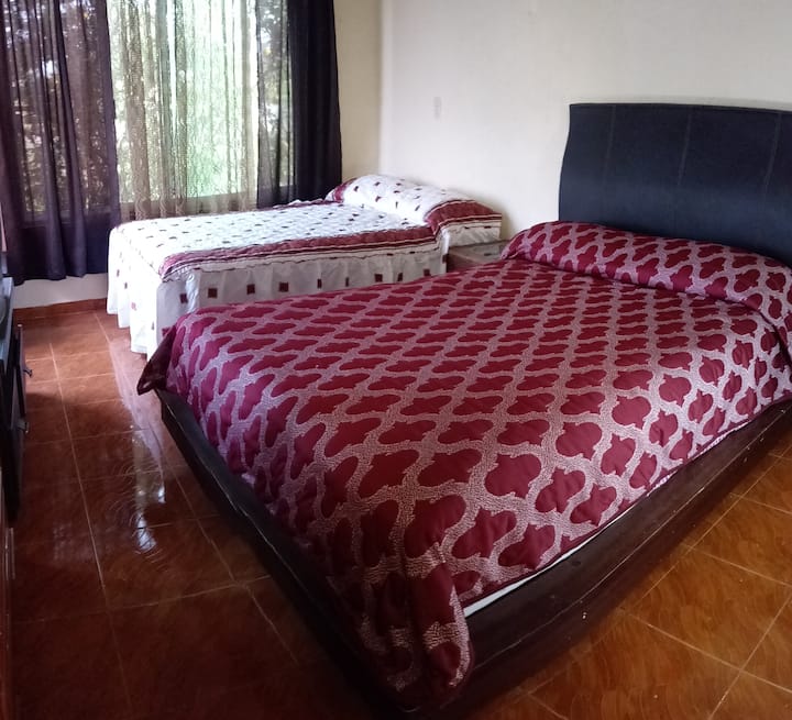 Large bedroom overlooking the pool and two comfortable double beds and also has its bathroom and ceiling fan as well as the other bedrooms, which also have 24-hour hot water 