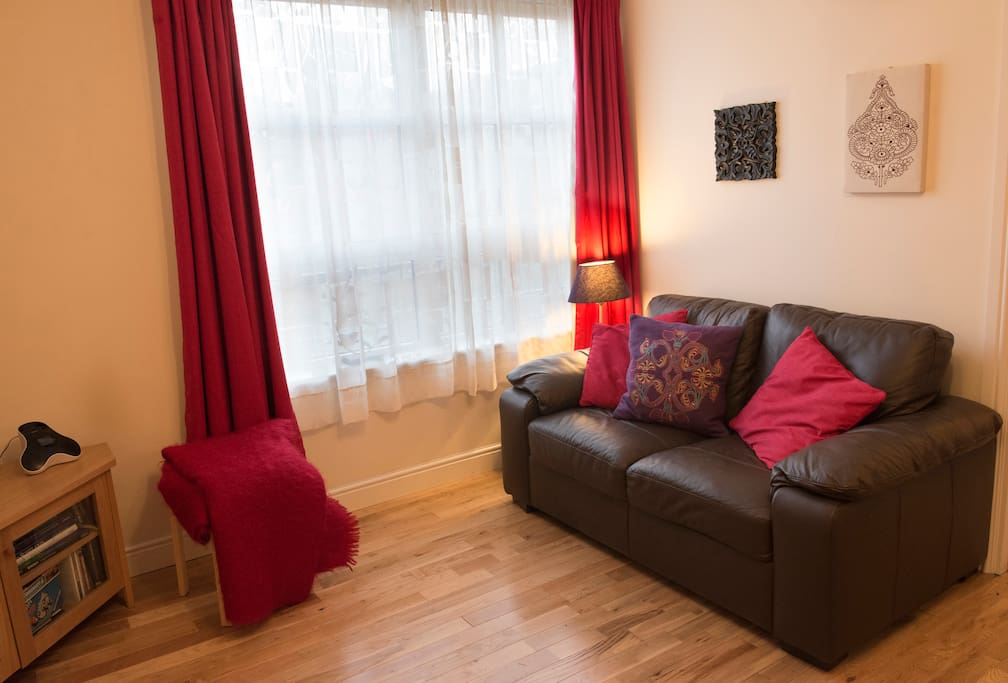 Comfortable lounge with 2 quality leather settees, "Living flame" electric fire, TV and DVD/ CD player