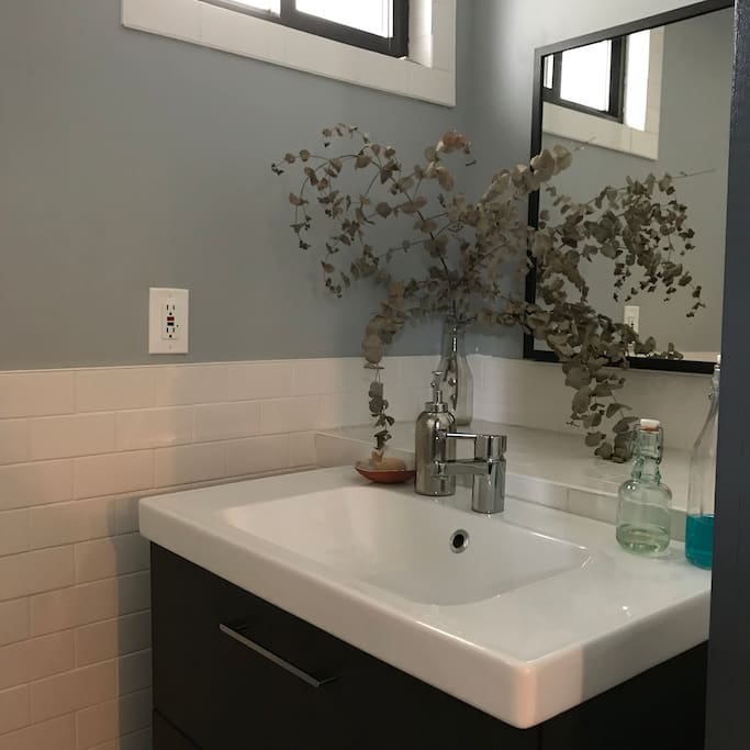 Shared bathroom. Shower only, but it’s a big shower.