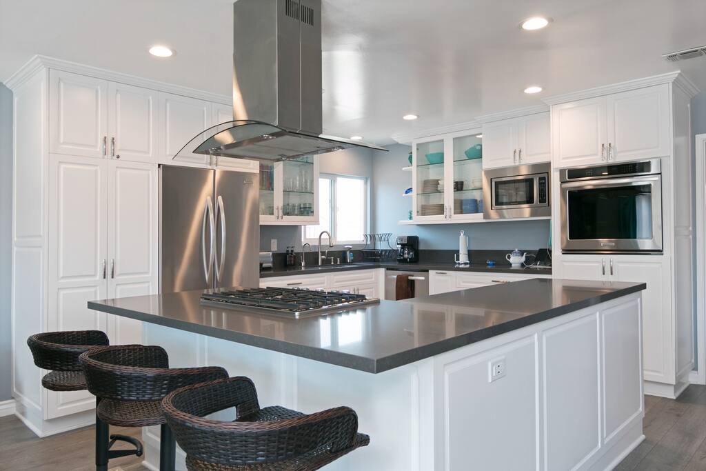 Sip morning coffee from a breakfast bar with seating for three.