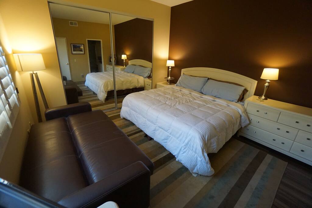 Large guest bedroom with couch folded down as 68" x 43" bed.
