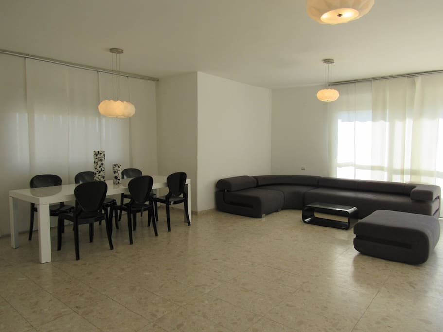 Living room first floor with kitchen and one balcony