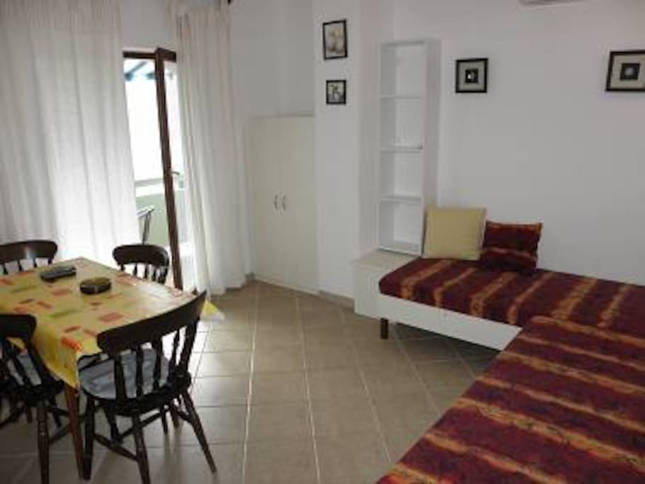 Living room with two sofa beds and access to balcony