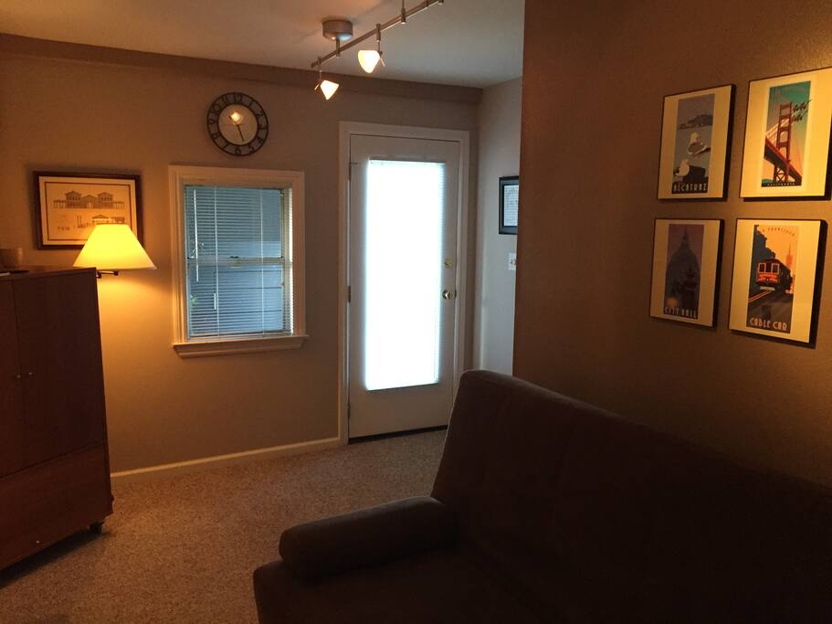 Den showing entrance door