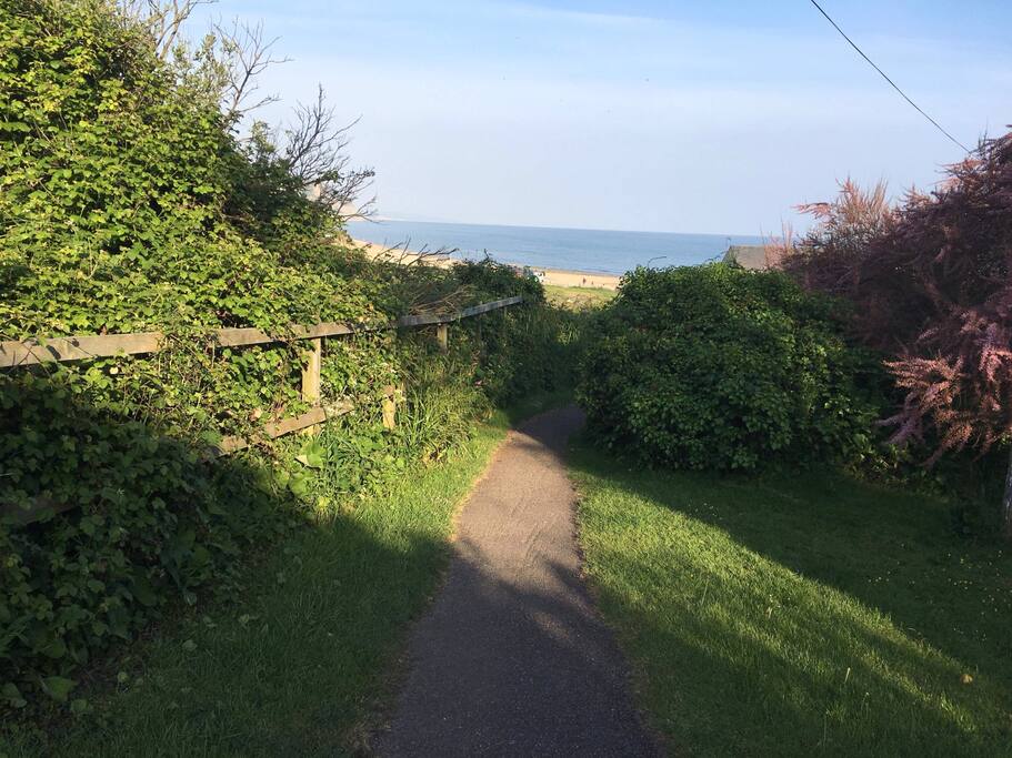 Short walk to beach from private gardens