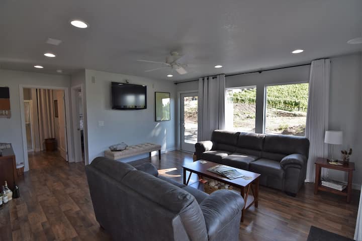 Want to unwind? Relax in our living room looking out on working vineyard while enjoying surround sound. Or watch a movie(limited options), play a game or read a book. Space is shared during tasting room hours.