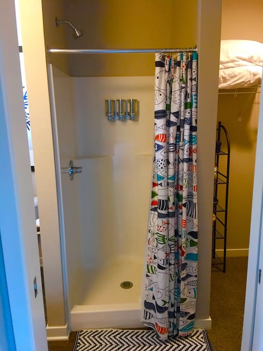 Private shower with provided shampoo, conditioner and body wash.