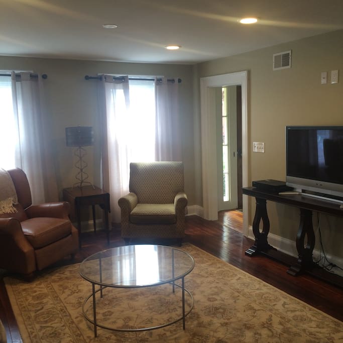 Bright and inviting living room with flat screen TV and WiFi throughout the house