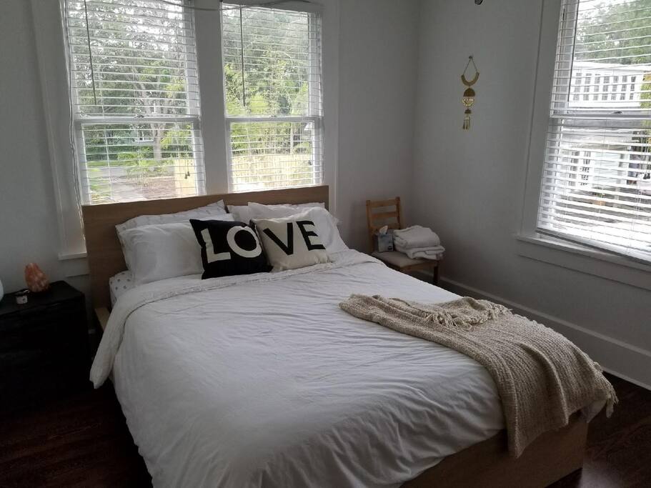 Queen bed Curtains and two night stands have been added to this space