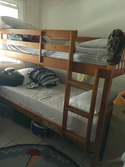Twin bunk beds and lots of toys in 2nd bedroom.