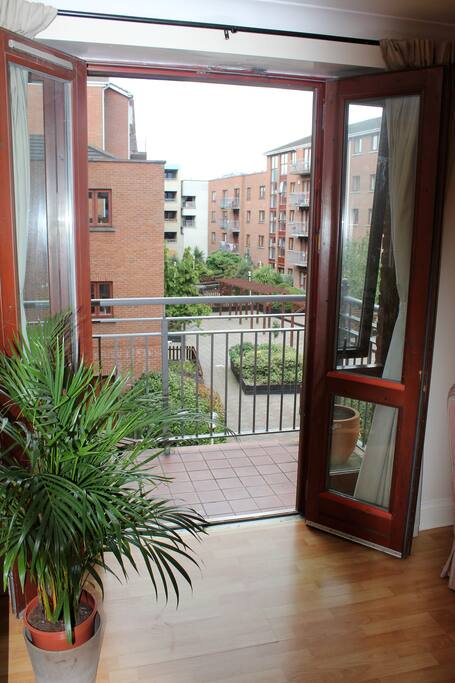 Living room balcony overlooking courtyard