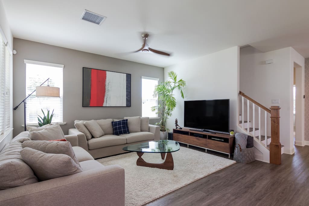 Living area with 65 inch flat screen television