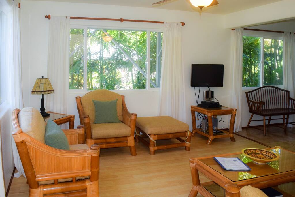 The home is stylishly decorated with quality furnishings.Living room with seating and TV.