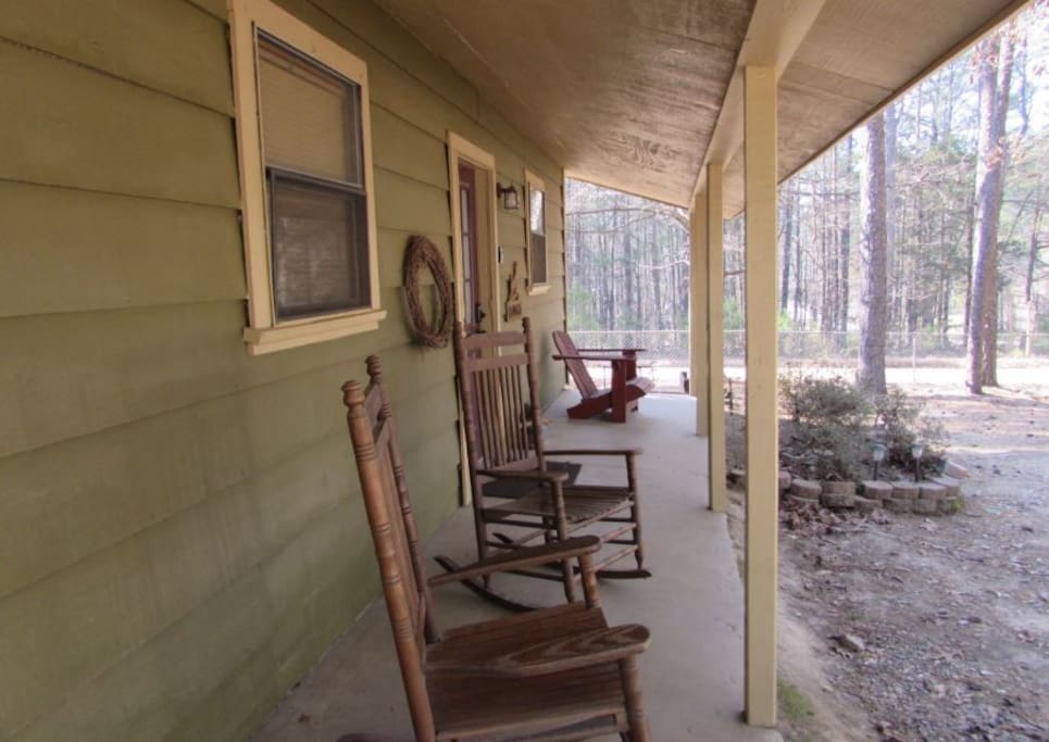 Enjoy looking into the forrest while sitting in a rocking chair