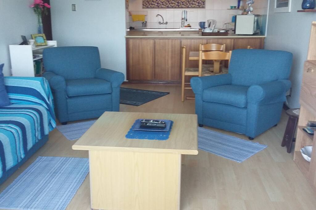 The lounge area with couch and armchairs.