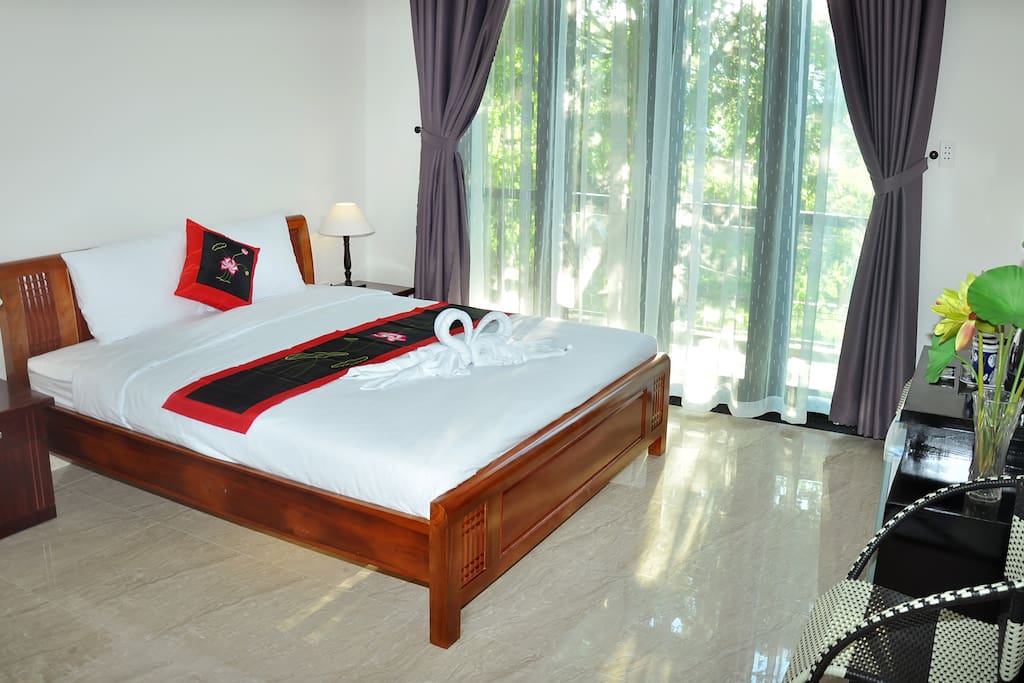 Spacious bedroom with one king size bed