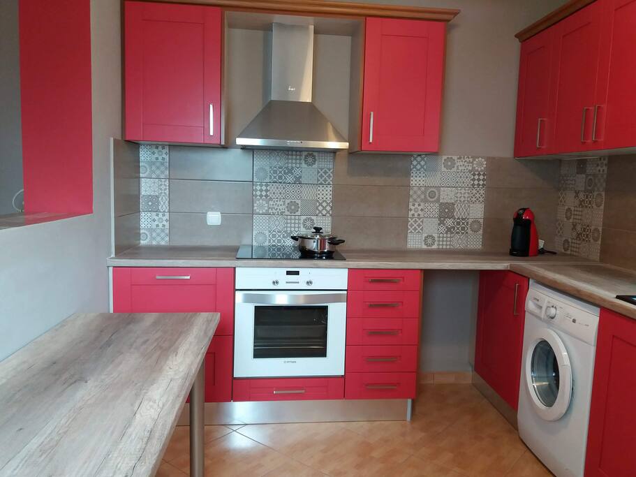 A well-equipped kitchen is a part of a living room