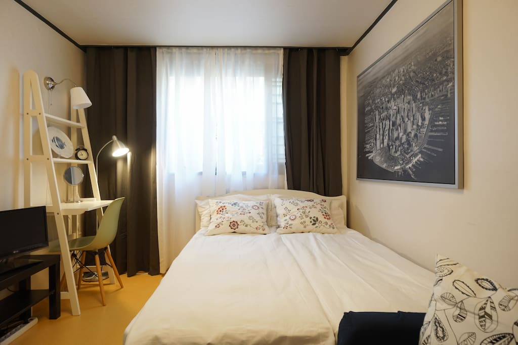 Queen sized bed with two separate duck feather blanket s and pillows for your comfortable sleep.