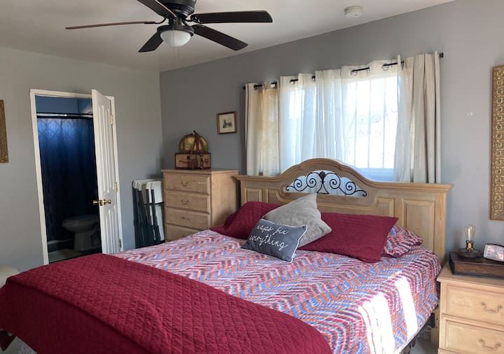 The Downstairs master bedroom boasts a luxurious king size bed and a private bathroom with tub. There is also a twin size bed in the under stairs cubby. Perfect for a family sharing a room with their child!