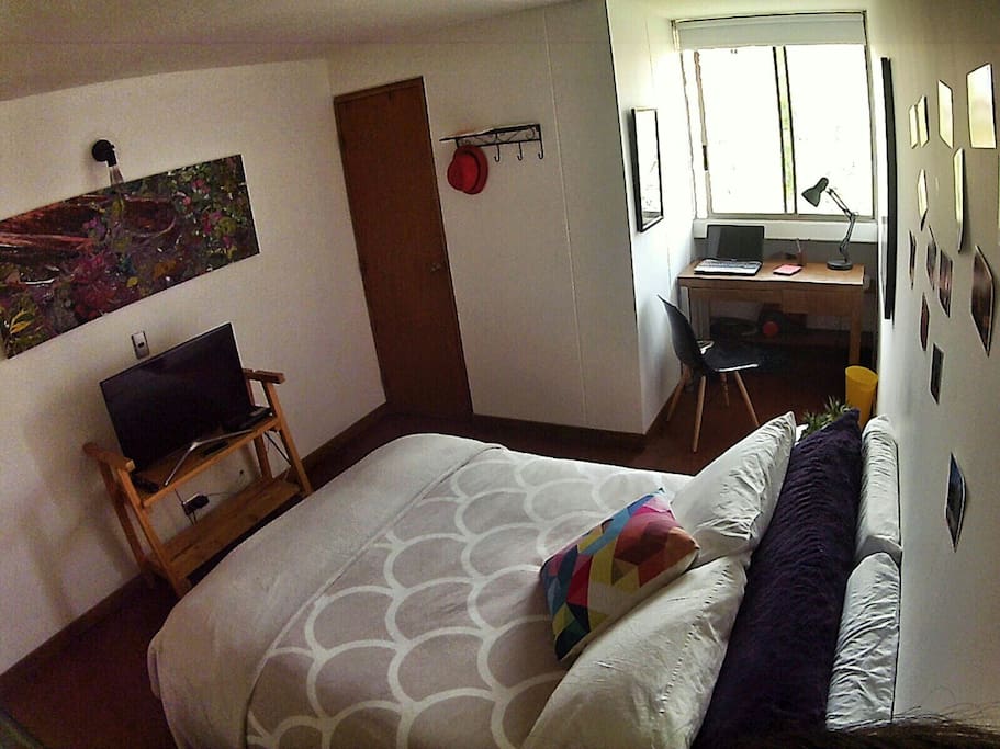 The room has a comfortable full bed, a desk, a nice window, a walk-in closet and a 32 inch TV connected to Netflix