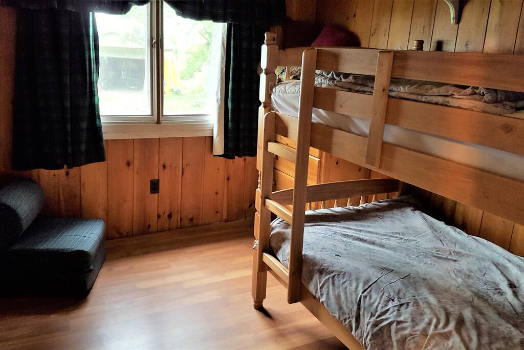 Back bedroom; lake facing
Breeze off lake, dresser, fold out foam chair for laying surface