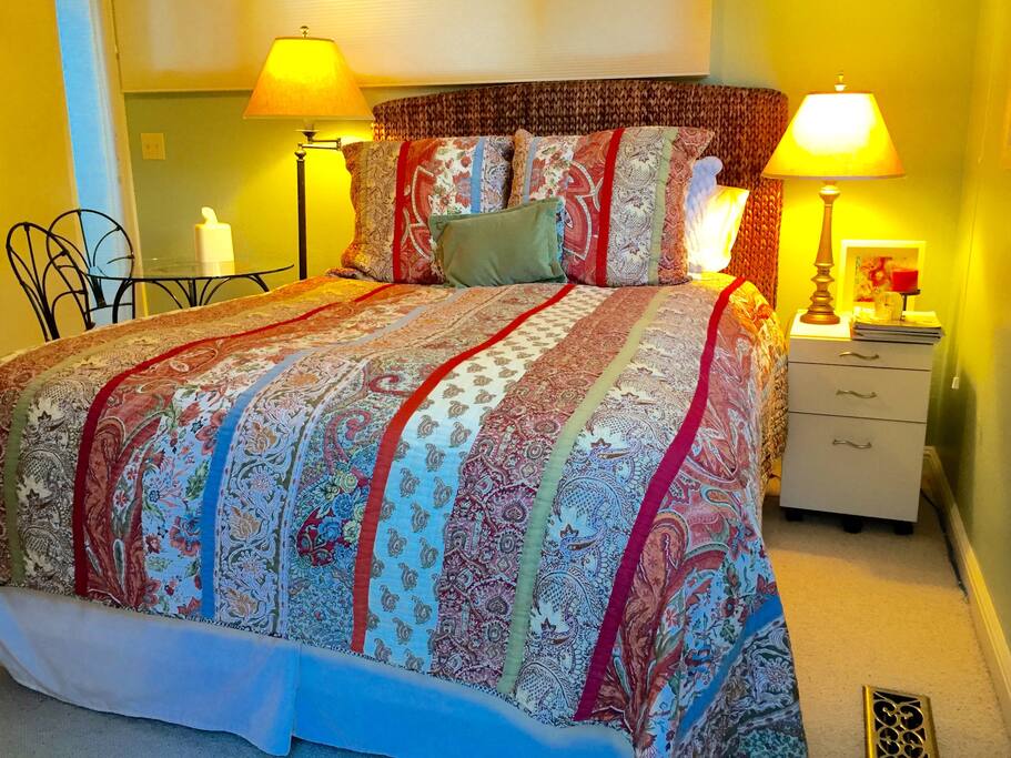 Queen Size Bed with down duvet, twin reading lights.