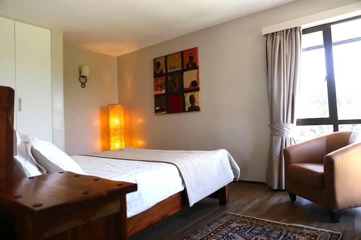 Bedroom 3, queen bed with view of Mt. Kenya