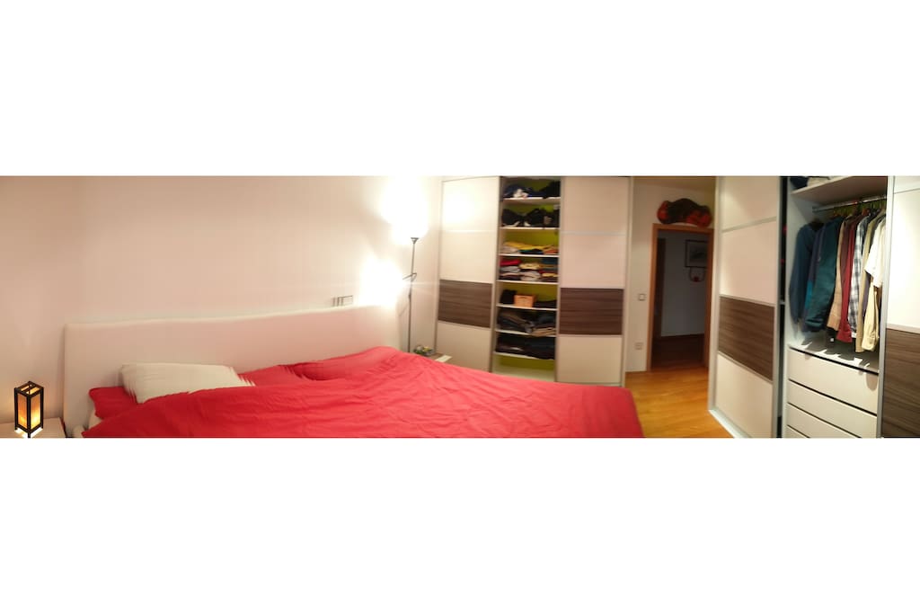 Sleeping room with a queen bed, plenty of storage room
