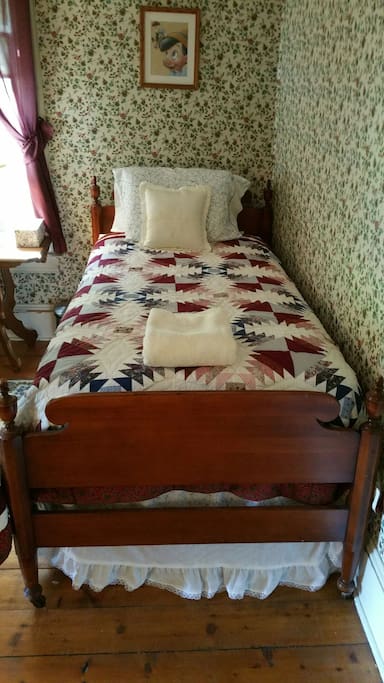 The "North" Twin bed (on the north side of the room).