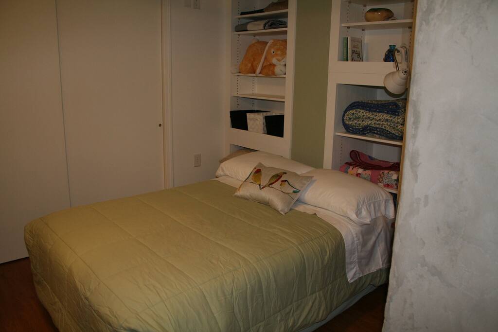walking space on either side of full size bed in private bedroom