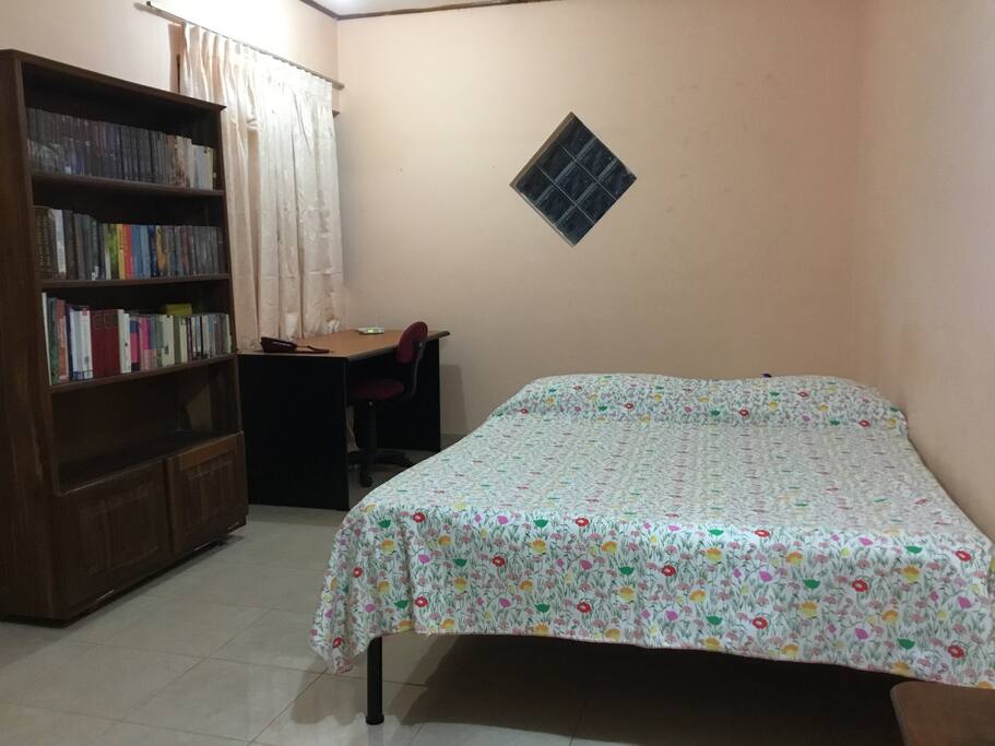 Spacious bedroom with double bed .