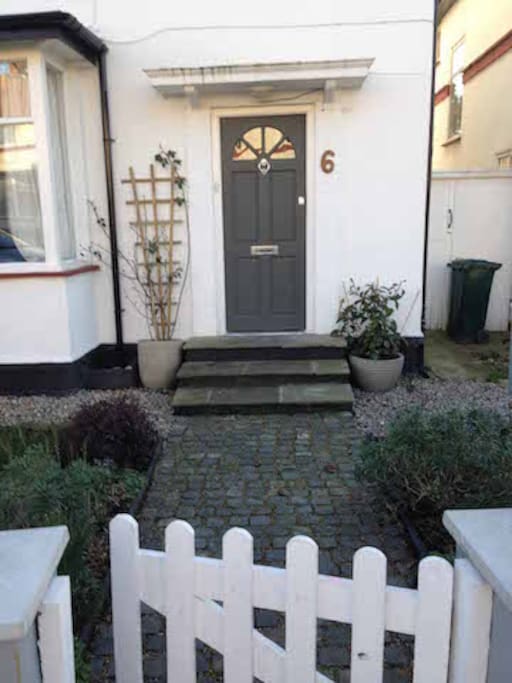 Front door with classic English cobbled pathway