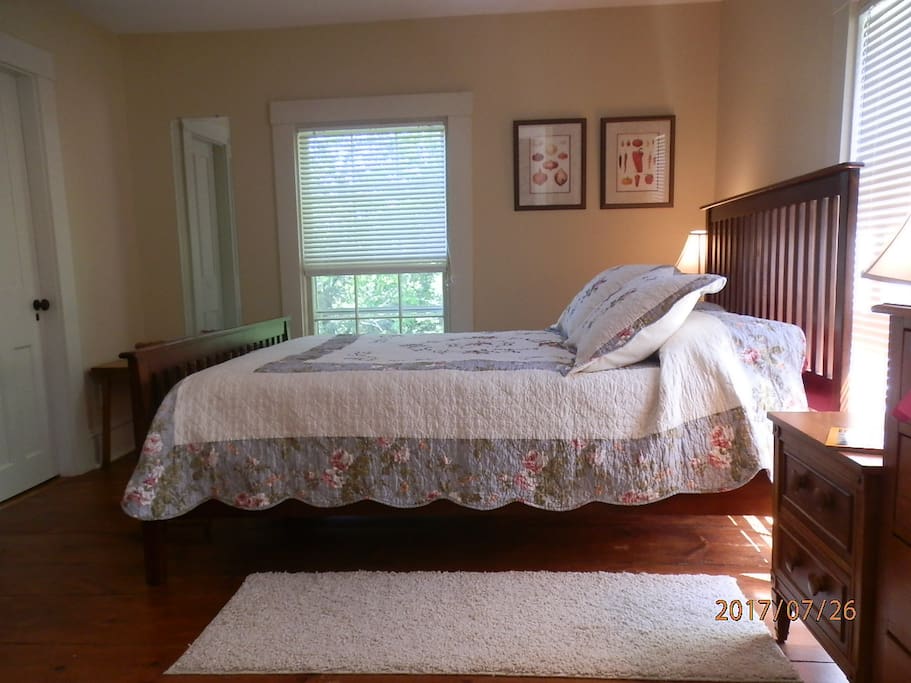 The Rose Room, with a queen bed, is a quiet room overlooking the garden.