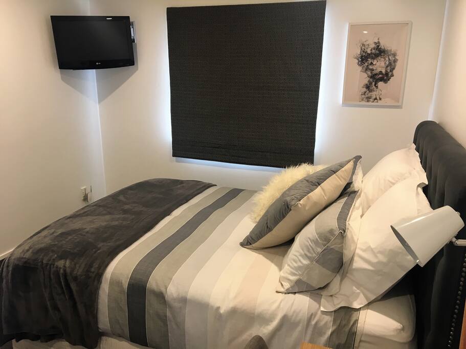 Our bedroom is great for snuggling with the TV on!